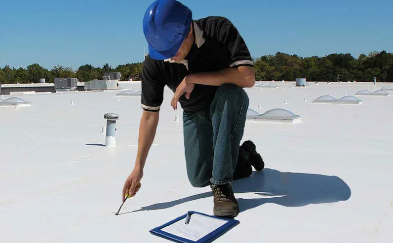 A commercial roof inspection in progress